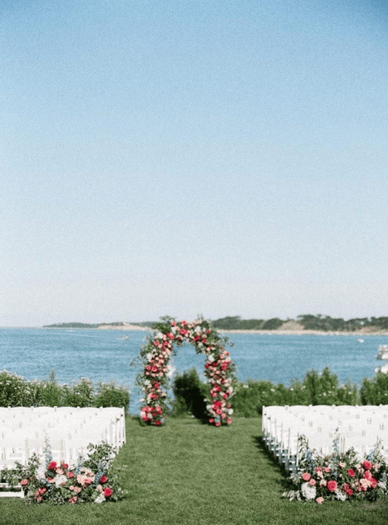 Outdoor wedding ceremony set up in front of the water at Wequassett Resort & Golf Club